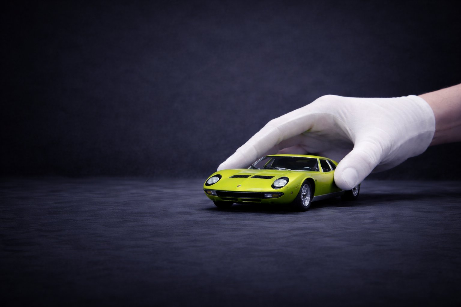 Diecast collector holding a Lamborghini Miura